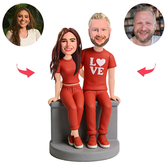 A Couple in Red Outfits Are Sitting Custom Bobbleheads